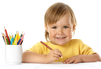 Image showing Cute child draw with crayons and smile