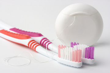 Image showing Two toothbrushes and dental floss