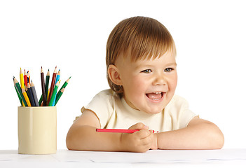 Image showing Child draw with red crayon