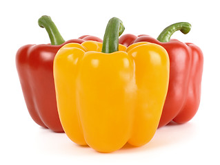 Image showing Three bell peppers: one yellow and two red behind