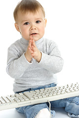 Image showing Cute child begging IT support for help