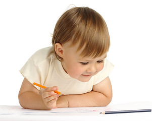 Image showing Child draw with orange crayon