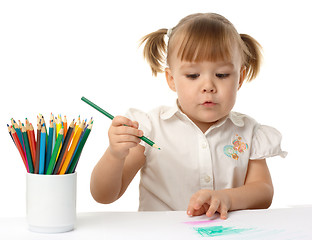 Image showing Cute child draw with color pencils