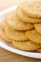 Image showing Yellow crackers on plate