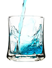 Image showing Splash, blue drink is being poured into glass