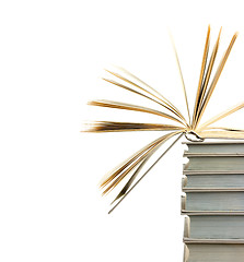 Image showing A pile of books and the one open at top