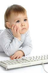 Image showing Cute child focused on monitor
