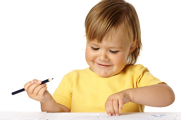 Image showing Playful child draw with crayons and smile