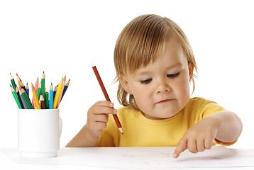 Image showing Child points on his drawing