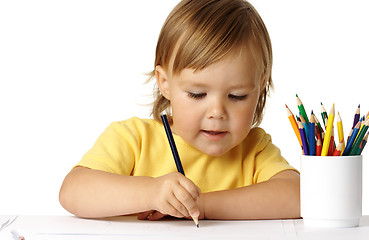 Image showing Cute preschooler focused on her drawing
