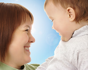 Image showing Happy mother looking at her child