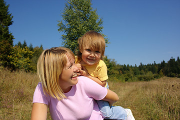 Image showing Mother and child play outdoors