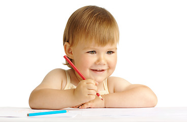 Image showing Happy child smile and draw with red crayon