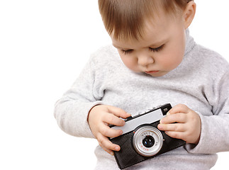 Image showing Cute child play with photocamera