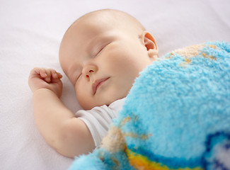 Image showing Cute child is sleeping in bed