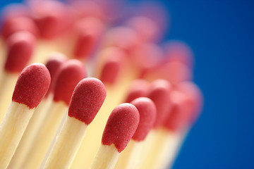 Image showing Red matchsticks on blue background