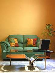 Image showing Picture of a sofa with alot of wall space above it. Picture good for interior design,etc