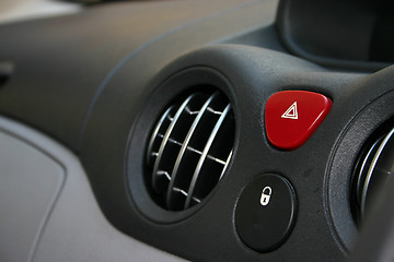 Image showing Dashboard detail of air vents section, hazard button and central locking button