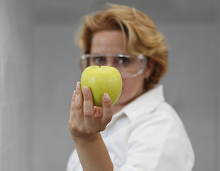 Image showing Female Scientist Offering Natural Food