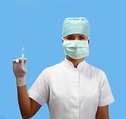 Image showing Female nurse holding a syringe