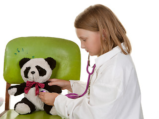 Image showing girl playing doctor with her toys
