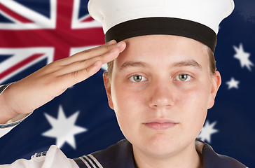 Image showing young sailor saluting isolated white background