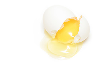 Image showing cracked egg over white