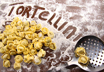 Image showing Fresh, raw tortellini with flour