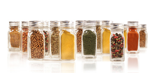 Image showing Assorted spice bottles isolated on white