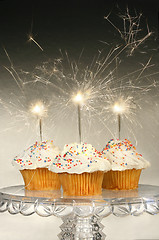 Image showing Cupcakes with sparklers