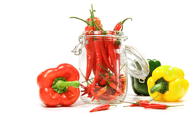 Image showing Red peppers in glass jar isolated on white 