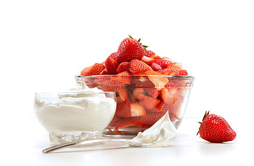 Image showing Fresh strawberries with whipped cream on white