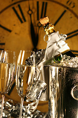 Image showing Champagne in bucket with glasses ready for New Years 