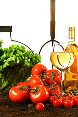 Image showing Fresh tomatoes, lettuce and wine