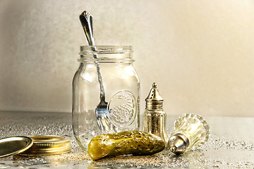 Image showing Pickle with a jar and antique salt and pepper shakers