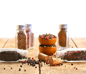 Image showing Spice glass containers on old wood table