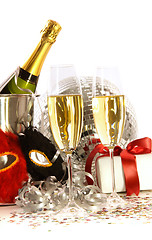 Image showing Glasses of champagne with mask and gift