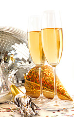 Image showing Champagne glass with gold party hats