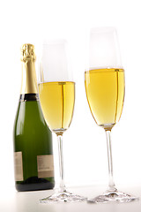 Image showing Champagne glasses with bottle on white 