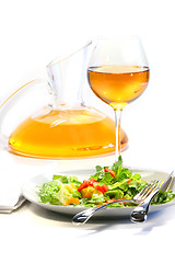 Image showing Plate of salad and wine glass