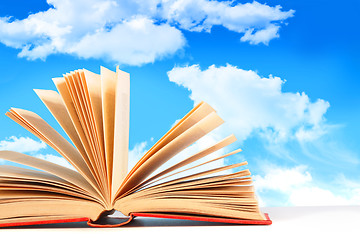 Image showing Open book against a blue sky