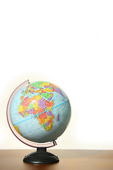 Image showing Globe with stand on desk