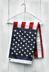 Image showing American flag folded with clothes hanger