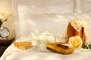 Image showing Tea in bed with chocolates