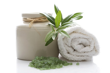 Image showing fresh olive branch and bath salt. spa