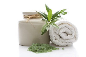 Image showing fresh olive branch and bath salt. spa