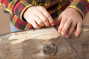 Image showing Marking A Log