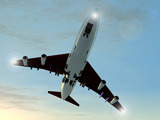 Image showing A plane flying high in the sky.