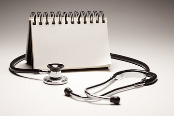 Image showing Blank Spiral Note Pad and Black Stethoscope