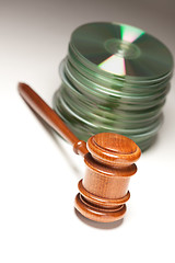 Image showing Stack of CD Rom or DVD Discs and Gavel